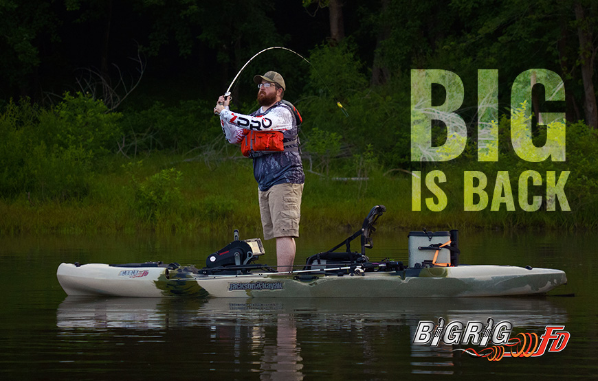 man standing and casting from a Jackson Kayak Big Rig FD with caption BIG IS BACK