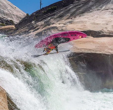 Person flying through whitewater with a Jackson Kayak Flow kayak.