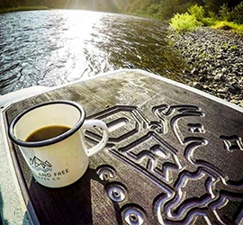 Cup of coffee on top of an Orion Cooler.