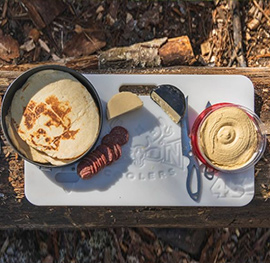 Food on top of an Orion Cooler.