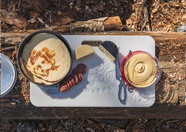 Food on top of an Orion Cooler for mobile.