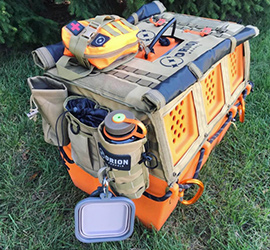 Orion dog kennel with accessories on it.