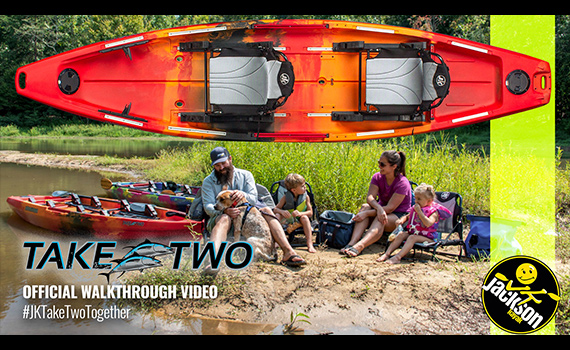 family sitting with jackson kayak taketwo kayaks on a beach camping